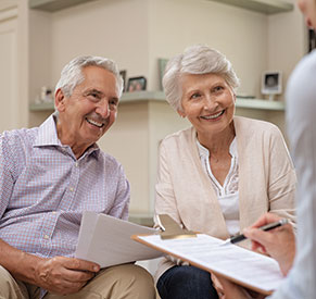 A couple talking to a person. Links to Gifts from Retirement Plans