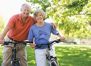 Photo of a man and woman on bicycles. Link to Life Stage Gift Planner Ages 60-70 Situations.